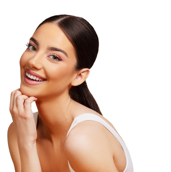 smiling woman with long dark hair and green eyes wearing a white top showing a radiant smile and posing with hands to face seven beauty tips for glowing skin